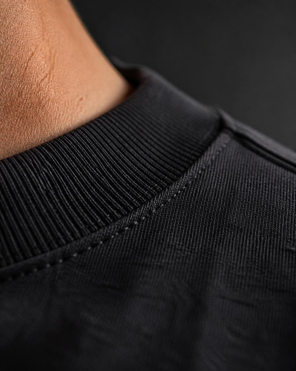 Close-up of the shoulder seam and ribbed collar